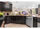 Well-equipped kitchen showcases granite countertops, stainless steel appliances, and dark wood cabinetry at 3901 Silverlake Way, Wesley Chapel, FL 33544