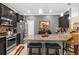 Bright kitchen boasts granite countertops, stainless appliances, and pendant lighting at 3901 Silverlake Way, Wesley Chapel, FL 33544
