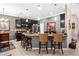 Well-equipped kitchen featuring granite counters, dark cabinets, stainless steel appliances, and a kitchen island at 3901 Silverlake Way, Wesley Chapel, FL 33544