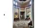 Elegant lobby with high ceilings, decorative chandelier, and comfortable seating at 3901 Silverlake Way, Wesley Chapel, FL 33544