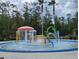 Community splash pad with colorful water features, creating a fun and playful environment for children at 3901 Silverlake Way, Wesley Chapel, FL 33544