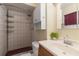 Bathroom featuring a tiled shower, modern sink, and vanity with updated fixtures at 39721 Meadowood Loop, Zephyrhills, FL 33542