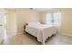 Bedroom featuring tile floors, natural light, and neutral paint at 39721 Meadowood Loop, Zephyrhills, FL 33542