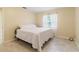 Bedroom featuring tile floors, natural light, and neutral paint at 39721 Meadowood Loop, Zephyrhills, FL 33542
