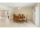 Dining area featuring tile flooring, a built-in shelf, and room to gather at 39721 Meadowood Loop, Zephyrhills, FL 33542