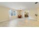 Bright dining area featuring tiled floors and a view into a separate dining space at 39721 Meadowood Loop, Zephyrhills, FL 33542