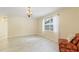 A cozy dining area filled with natural light and tiled floors at 39721 Meadowood Loop, Zephyrhills, FL 33542