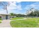 The well-maintained dog park features a restroom and ample green space for pets to roam and play at 39721 Meadowood Loop, Zephyrhills, FL 33542