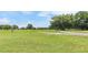 Expansive view of the community golf course with lush green fairways and blue sky at 39721 Meadowood Loop, Zephyrhills, FL 33542