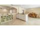 Kitchen and dining area with tile floors, open layout, and ample counter space at 39721 Meadowood Loop, Zephyrhills, FL 33542