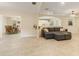 Spacious living room showcasing a connected dining area and kitchen, perfect for entertaining at 39721 Meadowood Loop, Zephyrhills, FL 33542