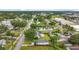Aerial view of residential area showcasing property with spacious yard, mature trees, and proximity to roadways at 4339 58 N Ave, St Petersburg, FL 33714