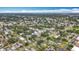 Sweeping aerial view of a residential area with lush tree cover and diverse housing styles, promoting a sense of community at 4339 58 N Ave, St Petersburg, FL 33714