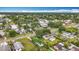 Aerial view showcasing the home's location in a tree-filled residential area and convenient access to nearby streets at 4339 58 N Ave, St Petersburg, FL 33714