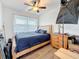 Inviting bedroom featuring a ceiling fan, large window, and natural light at 4339 58 N Ave, St Petersburg, FL 33714