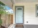 Detailed shot of the front door area, highlighting the entrance and nearby window at 4339 58 N Ave, St Petersburg, FL 33714