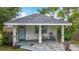 Inviting home showcasing a quaint front porch, comfortable seating, and meticulous landscaping at 4339 58 N Ave, St Petersburg, FL 33714