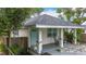 Charming bungalow featuring a welcoming front porch with rocking chairs and a well-maintained yard at 4339 58 N Ave, St Petersburg, FL 33714
