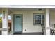 Close-up view of the front porch, featuring a charming entrance door and window at 4339 58 N Ave, St Petersburg, FL 33714