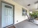 Inviting front porch featuring rocking chairs and classic siding, perfect for relaxing outdoors at 4339 58 N Ave, St Petersburg, FL 33714