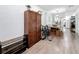 Hallway with hardwood floors, built in storage and leading to the kitchen and dining area at 4339 58 N Ave, St Petersburg, FL 33714