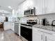 Modern kitchen with sleek stainless steel appliances and white cabinets, providing a clean aesthetic at 4339 58 N Ave, St Petersburg, FL 33714