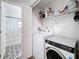 Laundry room area with washer and dryer next to the bathroom at 4339 58 N Ave, St Petersburg, FL 33714