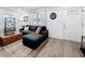 Bright living room with hardwood floors, a comfortable sofa, and large windows for ample natural light at 4339 58 N Ave, St Petersburg, FL 33714