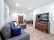 Bright living space with comfortable seating, a large television, and easy access to the kitchen at 4339 58 N Ave, St Petersburg, FL 33714