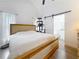 Spacious main bedroom with hardwood floors, a king bed, and an ensuite bathroom at 4339 58 N Ave, St Petersburg, FL 33714