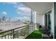 City views from the balcony with green turf, patio furniture, and scenic views of the surrounding skyline at 450 Knights Run Ave # 1003, Tampa, FL 33602
