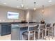 Modern bar featuring stylish seating, a sink, and sleek countertops at 450 Knights Run Ave # 1003, Tampa, FL 33602