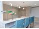 Stylish bar area with granite countertop, seating, and decorative fish sculpture at 450 Knights Run Ave # 1003, Tampa, FL 33602