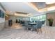 Well-lit common area featuring a bar area, tables with seating, and tasteful decor at 450 Knights Run Ave # 1003, Tampa, FL 33602