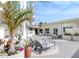 Resort-style courtyard featuring sun loungers, seating areas, and beautiful landscaping at 450 Knights Run Ave # 1003, Tampa, FL 33602