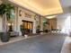 Exterior of the building entrance with a covered walkway and tropical landscaping at 450 Knights Run Ave # 1003, Tampa, FL 33602