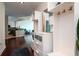 Inviting entryway featuring hardwood floors, custom built-ins, and a seamless flow to the living spaces at 450 Knights Run Ave # 1003, Tampa, FL 33602