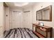 Hallway showing apartment door with console table and mirror at 450 Knights Run Ave # 1003, Tampa, FL 33602