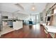 Open-concept living room featuring hardwood floors and a modern design at 450 Knights Run Ave # 1003, Tampa, FL 33602