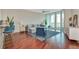 Open living room with views and access to the outdoor balcony at 450 Knights Run Ave # 1003, Tampa, FL 33602