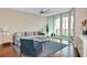 Living room with large windows and a comfortable seating area at 450 Knights Run Ave # 1003, Tampa, FL 33602