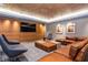 Relaxing lounge space featuring cozy seating, a built-in TV, and modern design elements at 450 Knights Run Ave # 1003, Tampa, FL 33602