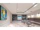 Relaxing lounge area featuring comfortable seating, stylish decor, and a large flat-screen television at 450 Knights Run Ave # 1003, Tampa, FL 33602