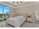 Serene main bedroom with a balcony and city views, complete with neutral tones and soft natural light at 450 Knights Run Ave # 1003, Tampa, FL 33602