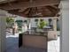 Outdoor grill area with granite countertops and high-end stainless steel appliances at 450 Knights Run Ave # 1003, Tampa, FL 33602