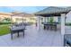 Outdoor patio with outdoor seating, grill and well-maintained landscaping at 450 Knights Run Ave # 1003, Tampa, FL 33602