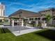 Outdoor patio with outdoor seating, grill, and lush green lawn at 450 Knights Run Ave # 1003, Tampa, FL 33602