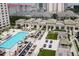 Community pool area with lounge seating and outdoor grill at 450 Knights Run Ave # 1003, Tampa, FL 33602