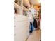 Organized walk-in closet features custom shelves, drawers, and ample hanging space for clothes and accessories at 450 Knights Run Ave # 1003, Tampa, FL 33602
