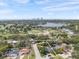 Aerial view of the home and neighborhood, featuring a lovely pool, landscaping, and close proximity to the city at 454 35Th Ne Ave, St Petersburg, FL 33704